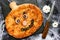 Pumpkin pizza with cheese, olive and sausage. Creative food idea