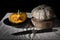 Pumpkin on plate with knife.