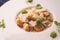 Pumpkin and potatoes gnocchi with mushrooms sauce