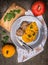 Pumpkin puree with meat patties in plate on old wooden table