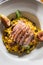 Pumpkin risotto roasted duck breast figs zucchini and min leaves. italian or mediterranean cuisine