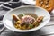 Pumpkin risotto roasted duck breast figs zucchini and min leaves. italian or mediterranean cuisine