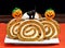 Pumpkin Roll Cake decorated for Halloween
