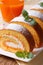 Pumpkin roll with cream cheese and juice. vertical