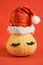 pumpkin in santa hat and false eyelashes on red background