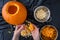 Pumpkin seed harvesting, womanâ€™s hands sorting seeds and pumpkin guts