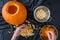 Pumpkin seed harvesting, womanâ€™s hands sorting seeds and pumpkin guts