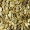 Pumpkin seeds background. Peeled