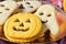 Pumpkin-shaped and ghost-shaped cookies