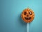Pumpkin shaped lollipop background.