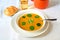 Pumpkin soup, bread,water and pot