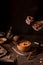 Pumpkin soup with crackers, atmospheric photo with hands.