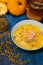 pumpkin soup with cream and shrimp, decorated with pumpkin seeds