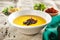 Pumpkin Soup on Rustic Tablecloth