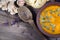 Pumpkin soup with toast, pumpkin seeds, ginger and garlic on a wooden table. vegetable vitamin soup. top view