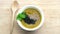 Pumpkin soup topped with white sesame and black sesame seeds