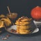 Pumpkin spice pancakes with caramel and pecan nuts