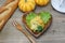 Pumpkin and sweet potato salad in a wooden plate