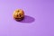 Pumpkin on a violet background, Halloween backdrop