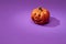 Pumpkin on a violet background, Halloween backdrop