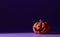 Pumpkin on a violet background, Halloween backdrop