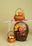 Pumpkins and Apples in Baskets on Wood Bench