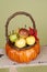 Pumpkins and Apples in Baskets on Wood Bench