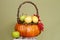 Pumpkins and Apples in Baskets on Wood Bench