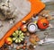 Pumpkins, apples, nuts,leaves, cups and sweater on wooden background.