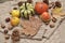 Pumpkins, apples, nuts,leaves, cups and sweater on wooden background.