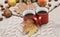 Pumpkins, apples, nuts,leaves, cups and sweater on wooden background.