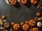 Pumpkins and autumn leaves on a dark background