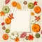 Pumpkins, autumn leaves and a notepad sheet on a wooden background. Vector illustration.