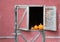 Pumpkins in barn window