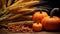 pumpkins corn and wheat on a wooden table