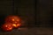pumpkins on a dark wooden cobweb background