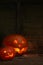 pumpkins on a dark wooden cobweb background