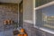 Pumpkins decorate a brick entry way of home