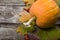 Pumpkins and fall leaves on a wooden table