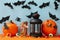 Pumpkins and halloween accessories on blue background