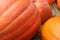 Pumpkins for Halloween on Bale of Hay in Autumn