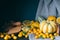 Pumpkins, Kumquats, Orange, Sweet Potato, Carrot, Autumn Composition on Dark Wooden Background, Toned Picture