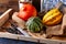 Pumpkins lying on a straw sack in a wooden box