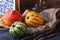 Pumpkins lying on a straw sack in a wooden box