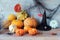 Pumpkins, mystical Halloween decorations, cobwebs, pumpkins, burning candles on a wooden background