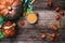 Pumpkins and soup with seeds and ground cherry on wood in Rustic