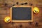 Pumpkins, spiders, bats and blackboard on wooden old table