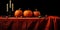 Pumpkins on the table. Candles in black candlesticks. Autumn still life. Halloween background