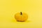 Pumpkins on a yellow background