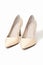 pumps high heel shoes, beige varnished leather footwear, elegant classic shoes on white background